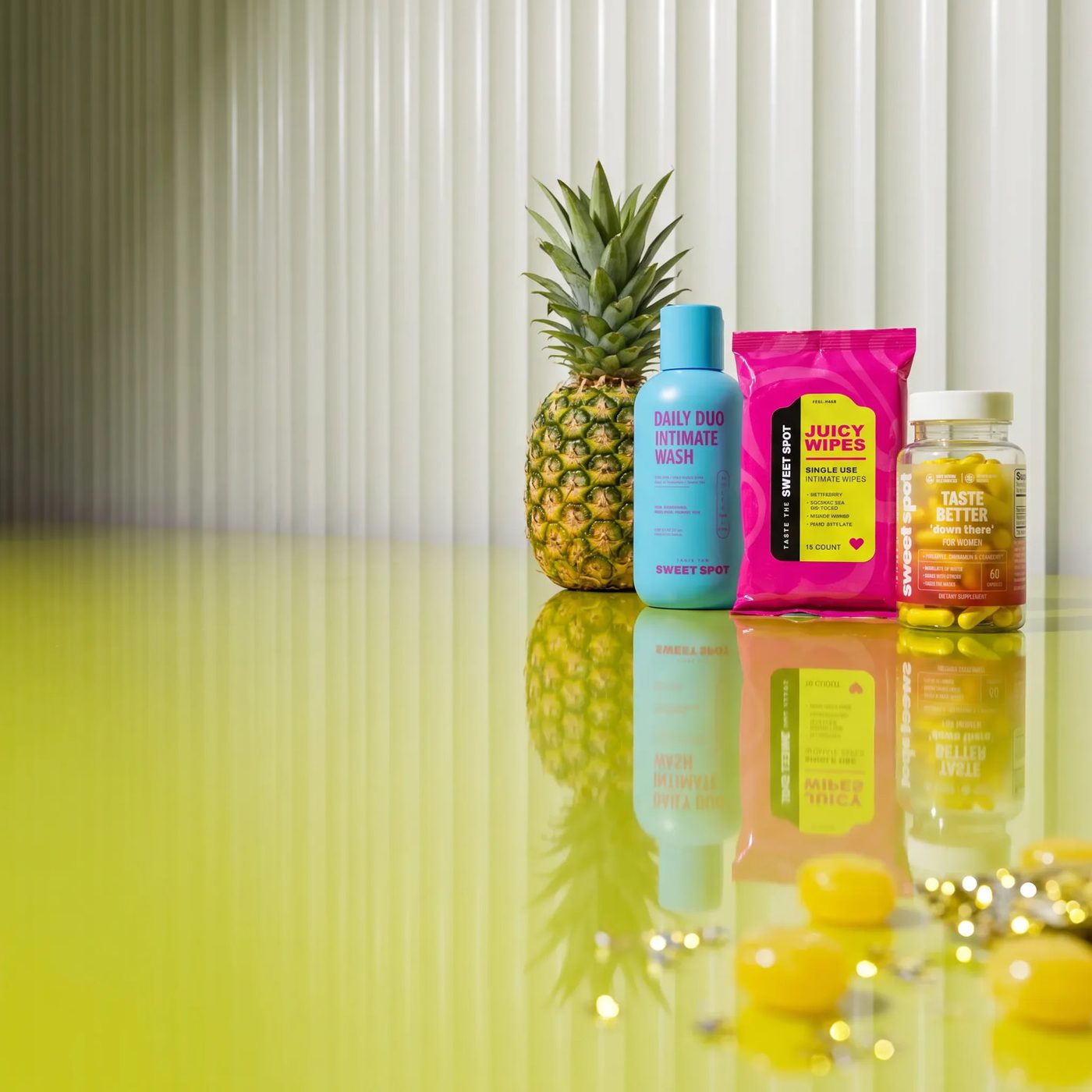 Daily Duo wash, Juicy Wipes, and the Taste Better bottle with a pineapple.