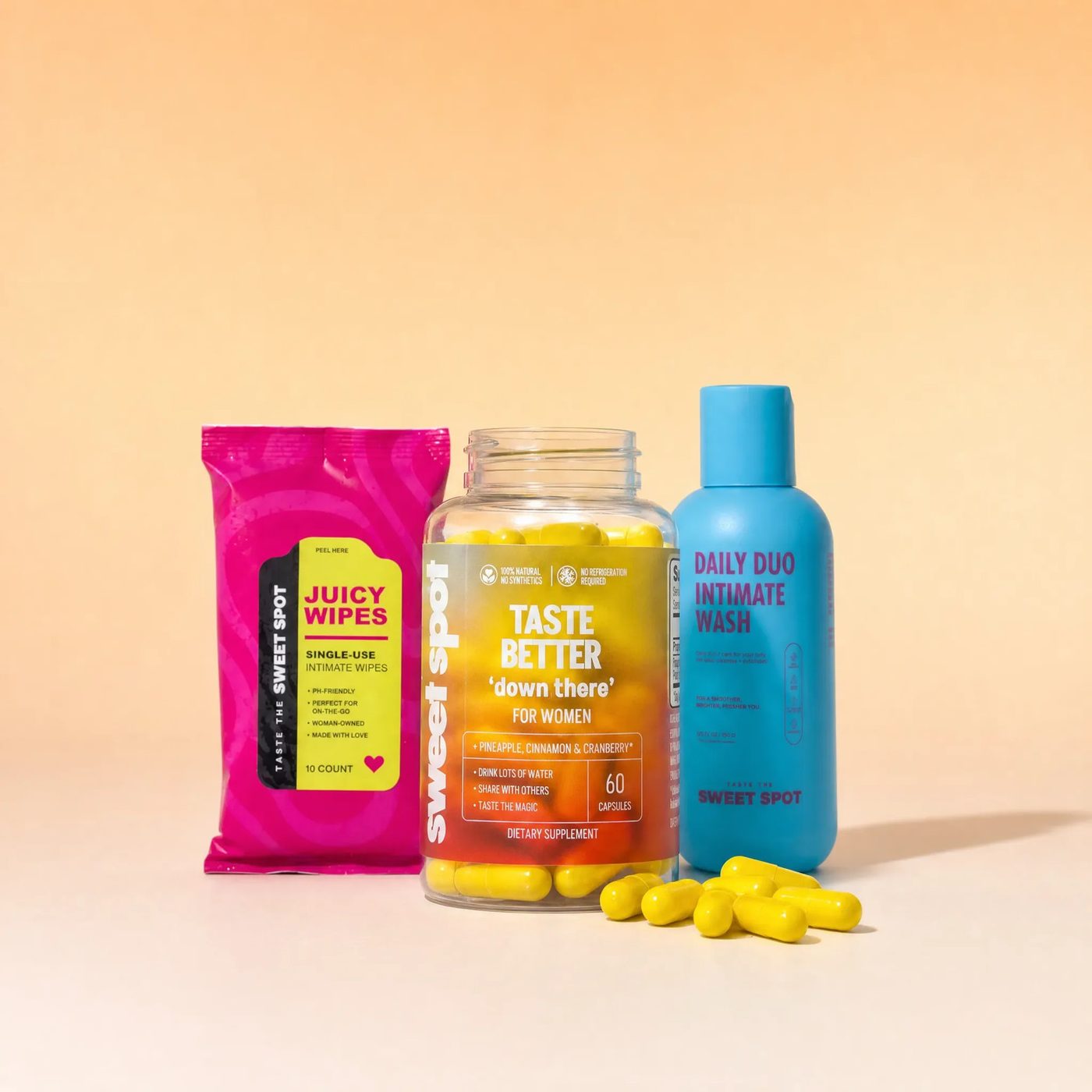 Juicy Wipes, an open capsule jar, and Daily Duo wash arranged together.